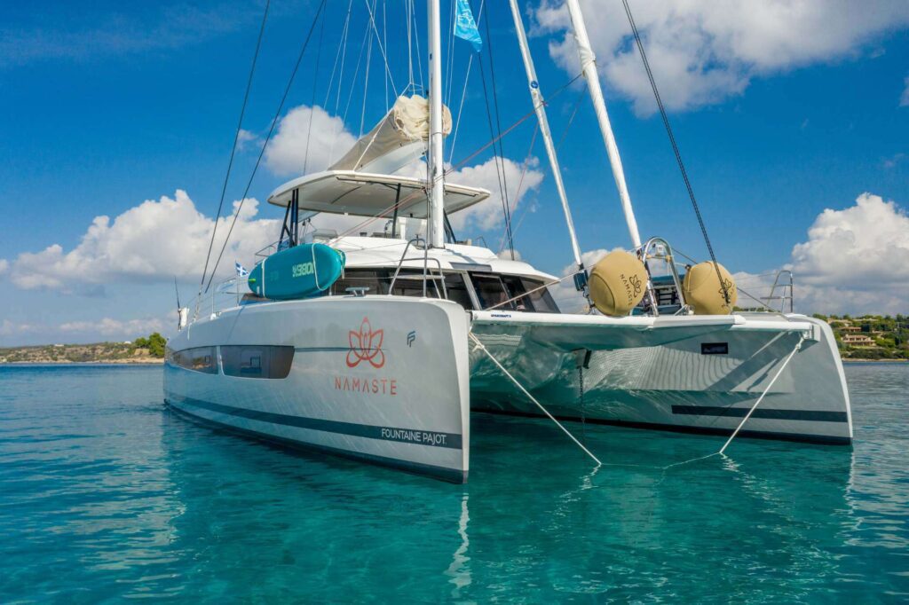 Namaste, A 8 passenger Fountaine Pajot 61' at anchor in Saronic Islands in Greece. Available for private crewed yacht charter by Wlms Yacht Charters