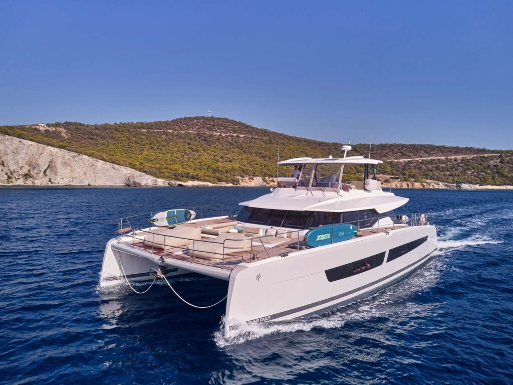 Elly, a 67 FP powercat underway in The Saronic Islands in Greece. Available for private crewed yacht charter in Greece by Wlms Yacht Charters