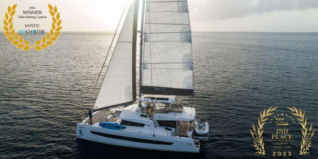 Mystic a awarding winning Bali 5.4 catamaran underway in The BVI. Available crewed yacht charter by Wlms Yacht Charters