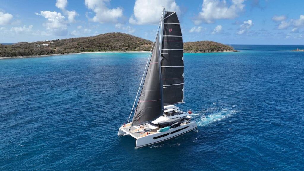 True North a Fountaine Pajot 67' underway near Drake Channel BVI. Available for crewed all inclusive yacht charter by Wlms Yacht Charters