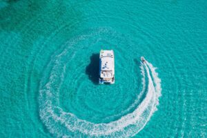 Indigo, a Horizon 60powercat. Drone overhead with dinghy. 