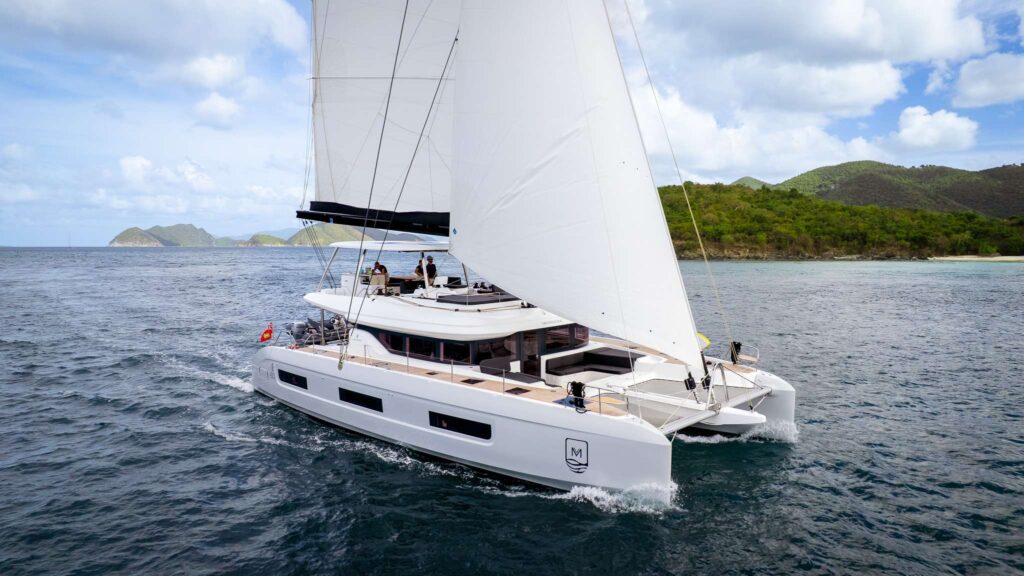 MInted One, a 2025 Lagoon 60, 8 passenger catamaran underway in Frances Drake Channel, Virgin Islands. Available for all inclusive crewed yacht charter by Wlms Yacht charters