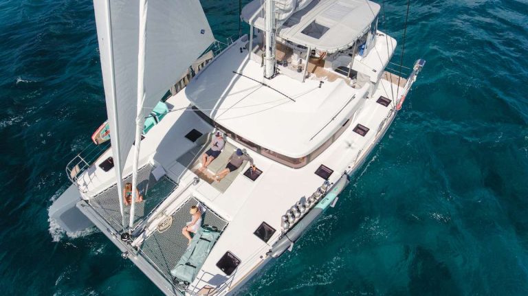 Liquid Zen catamaran underway available for all-inclusive private crewed yacht charter in the BVI.
